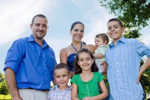Young family with smiles and ready to see the dentist
